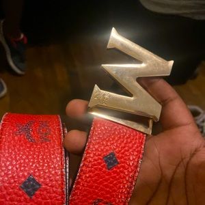 Red MCM belt with MCM card and box